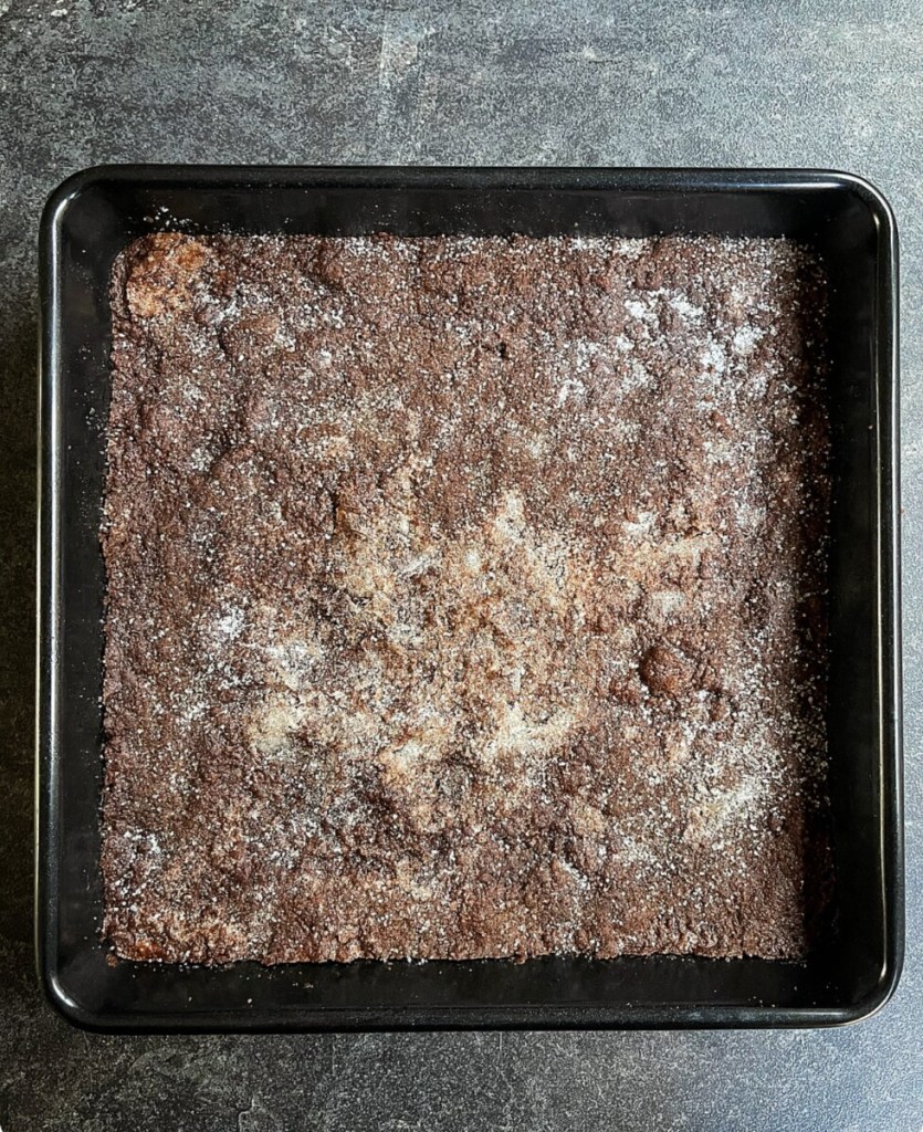 Chocolate concrete was so named because as this chocolate style shortbread cooled, it became very hard and crunchy, like concrete.
But don't let the name put you off, it's actually a very popular and delicious style bake, especially when served with custard.